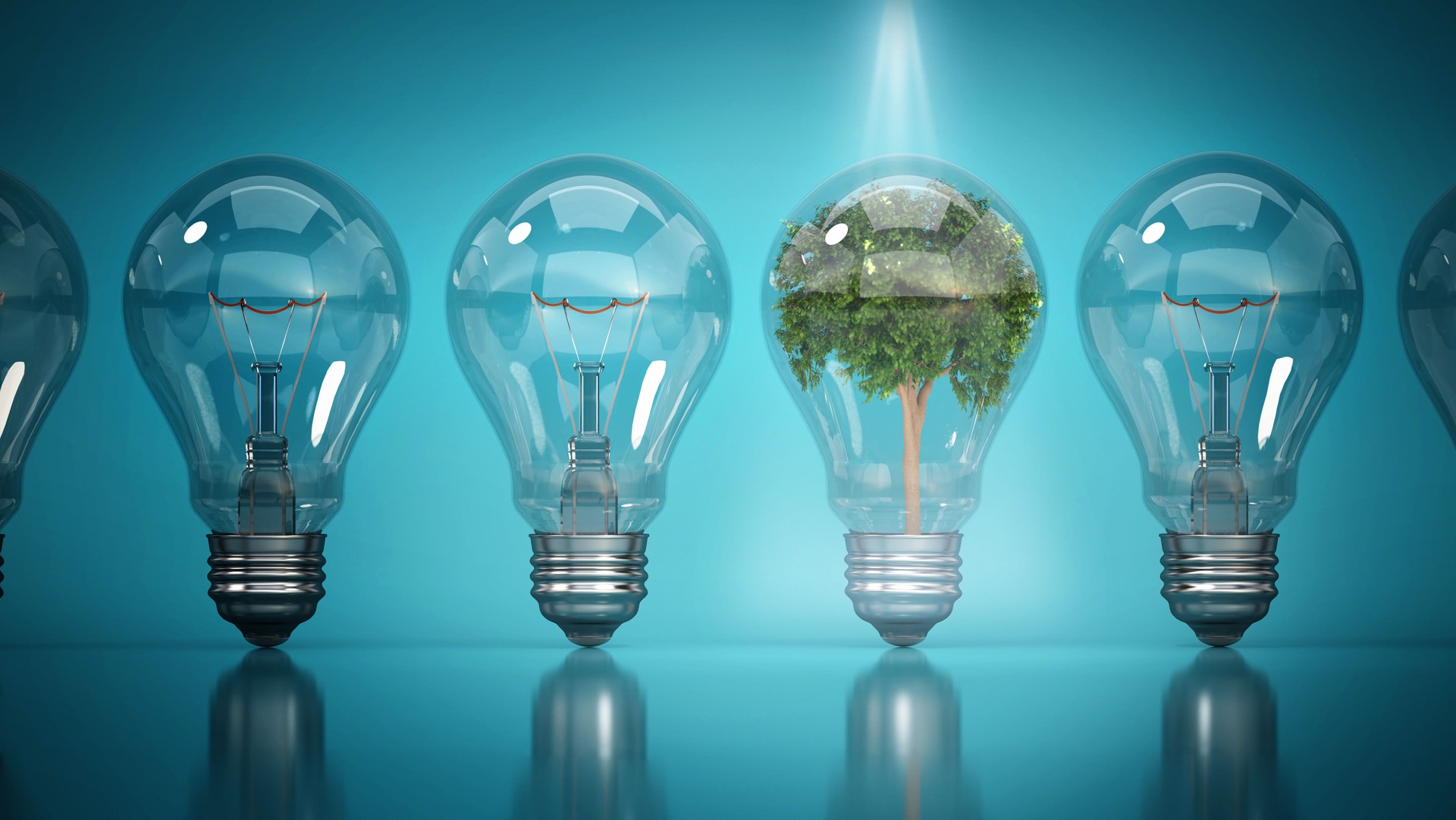 Innovative light bulbs showcase sustainable energy concepts with tree inside on a blue background as a representation of eco-friendly design